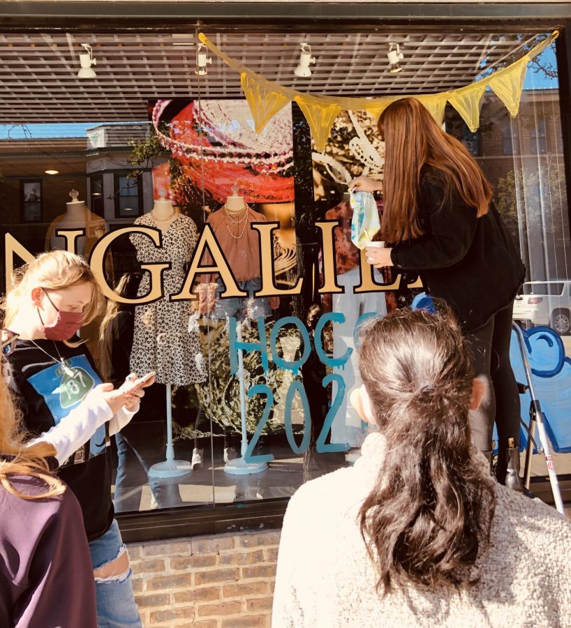 The JV1 swim team painted brightly colored circus ideas on the windows of Singalila.
