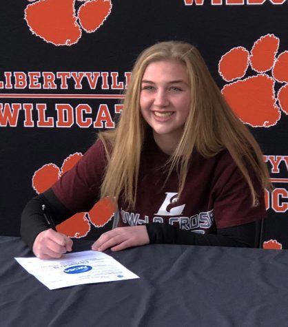 Megan Feeney signs her letter of intent for University of Wisconsin- La Crosse lacrosse.