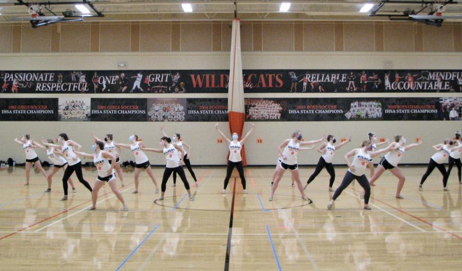 The LHS varsity dance team practice their dances with masks and a new vigor for their season.