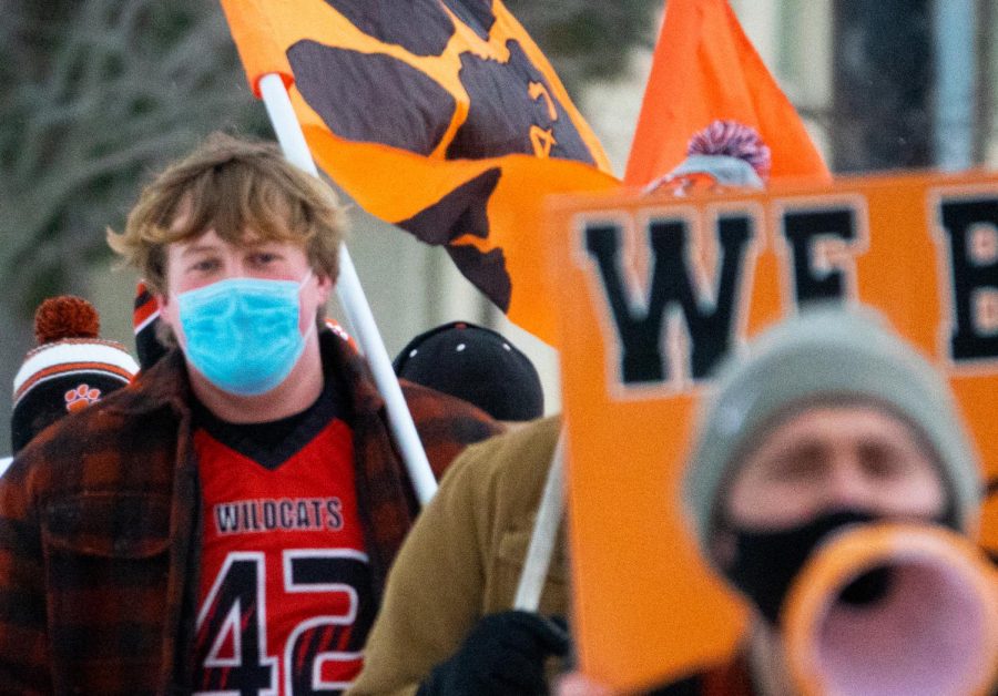 Many athletes held signs and flags reading messages such as “We Believe” and “Go Cats” during the rally.