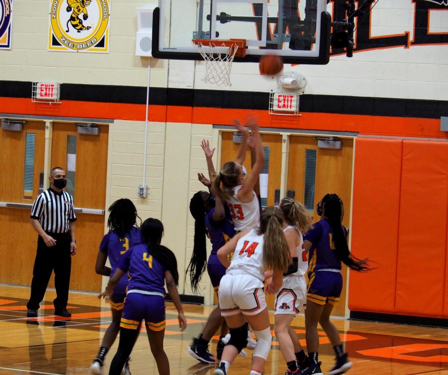 Senior Morgan Spaulding (33) jumps as she attempts to score.