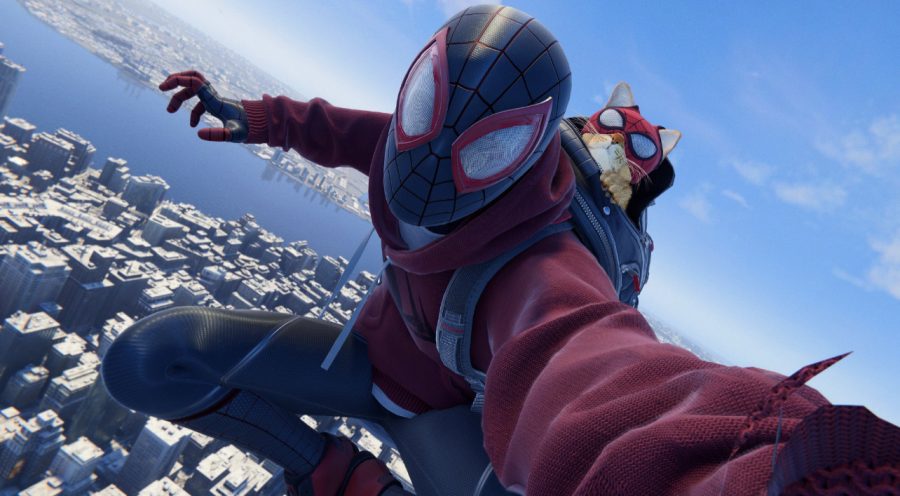 In “Spider-Man: Miles Morales,” players have the option to dress Miles in a variety of different suits, including this suit known as the “Bodega Suit.” With this suit, Spider-Man is aided in combat by a cat named after the titular wall-crawler. In-game screenshot.