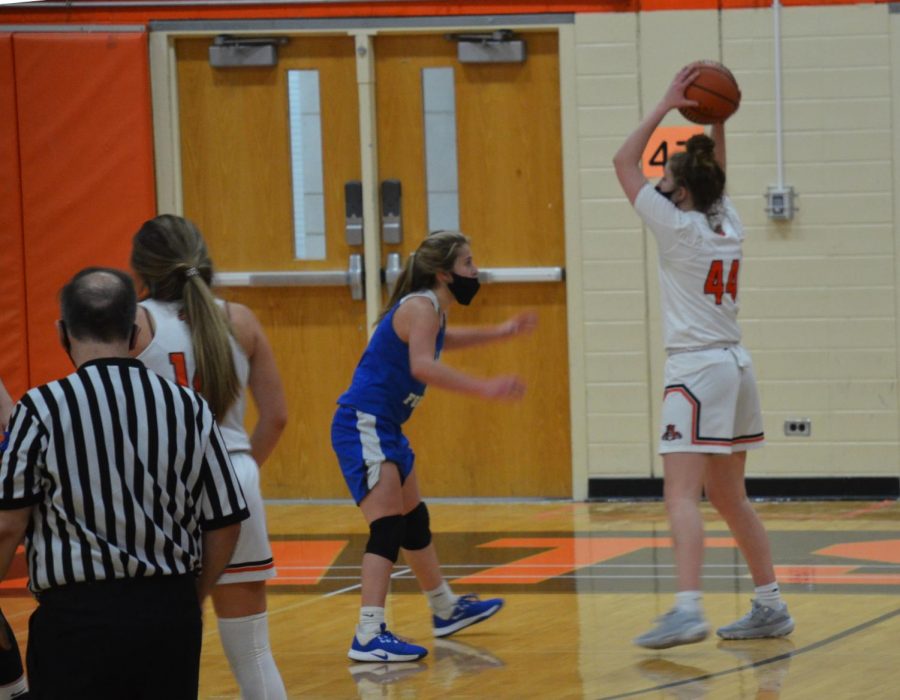 After a missed layup, senior Lauren Huber gets the rebound before passing it to Kate Rule, who made a 3-pointer, making the score 16-8.