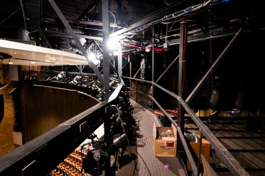 The catwalk above the auditorium stage gives crew members access to spotlights and other special effects. Its high vantage point allows them to spot any technical difficulties and execute the effects as planned.