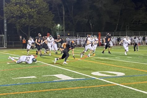 Matt Brenner (4) shakes off a defender and explodes into the open field.