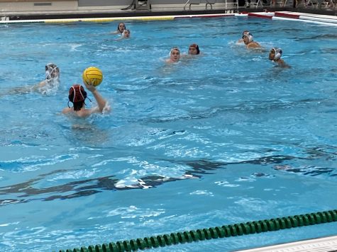 Jack Distenfield looks to pass to Andrew Clark while treading in place.