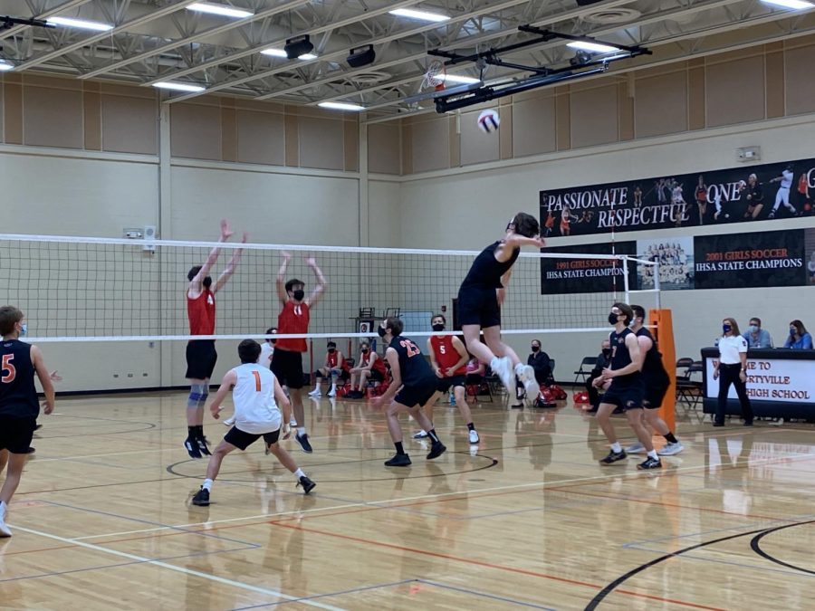 Oliver Sikora flies towards the net to spike the ball.