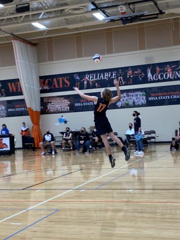 Jack Felinczak (17) serves as part of Libertyville’s second-set comeback run.