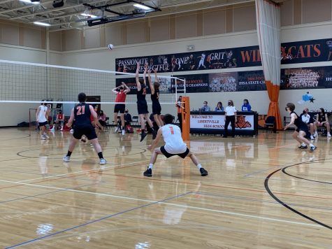 Grant Williams (25) and Ethan Lindberg (5) jump for the block as Reece Wiatrowksi (21), Matt Stokovich (1) and Jonathan Marquardt (7) get ready for a potential deflection.