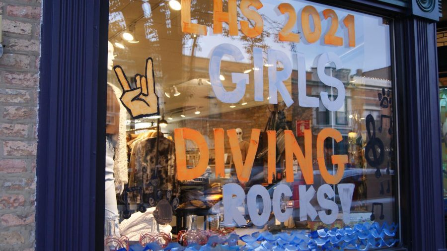 The girls diving windows combine diving and water elements with the homecoming rock theme.