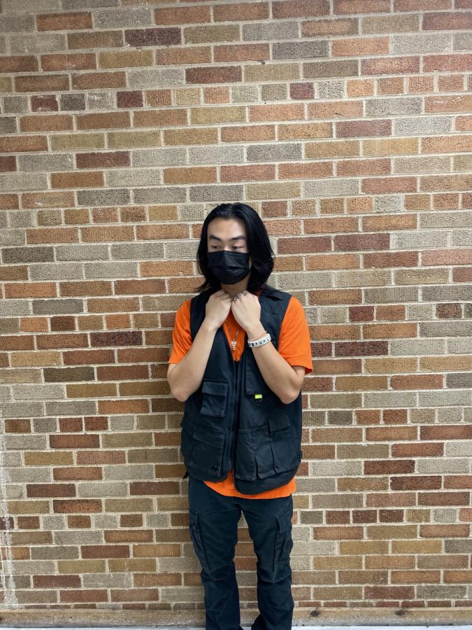 Rocking his orange on homecoming spirit week.