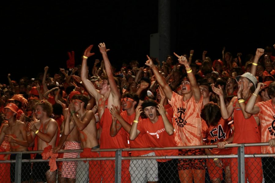 The seniors cheer during the first home football game. Every senior was standing by the rails, cheering as loud as possible throughout the whole game.
