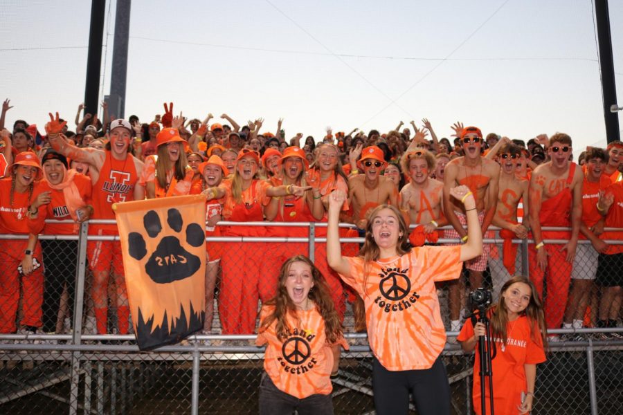 Grace Mudd (12) stands at the sidelines during the first home football game and leads the seniors’ cheers with Christian Roberts (12). “Being able to see the student section start screaming and start cheering just brings me a very genuine reaction and honestly just pure joy, because last year, you couldnt cheer like that” said Mudd.