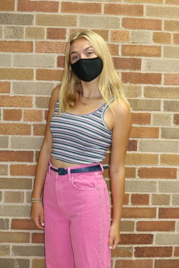 Kate Hopkins in a Brandy Melville tank, wide leg Zara pants, and a navy blue belt.