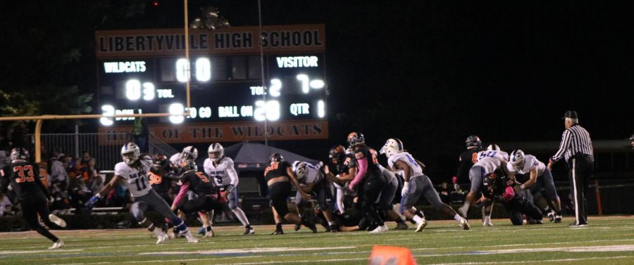 #33, junior Luke Williamson (far left) makes a break for the endzone in hopes of tying the score