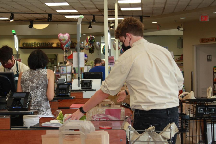 Peter Ericksen bags groceries at Sunset Foods during a four hour shift on a Saturday. 