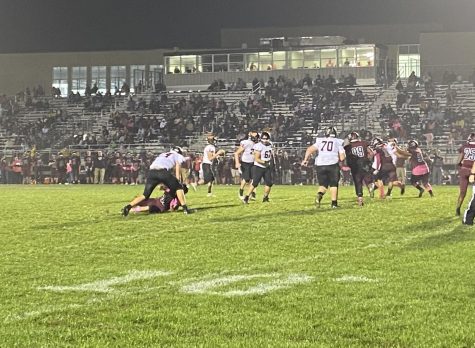 Trenton VanBoening (74) pancakes a Zee-Bee pass rusher while blocking for his quarterback.