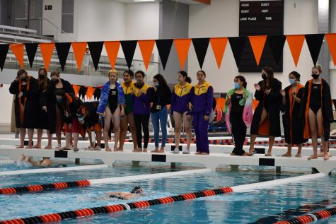 The Cats cheer on their teammates during the JV 400-yard freestyle relay.