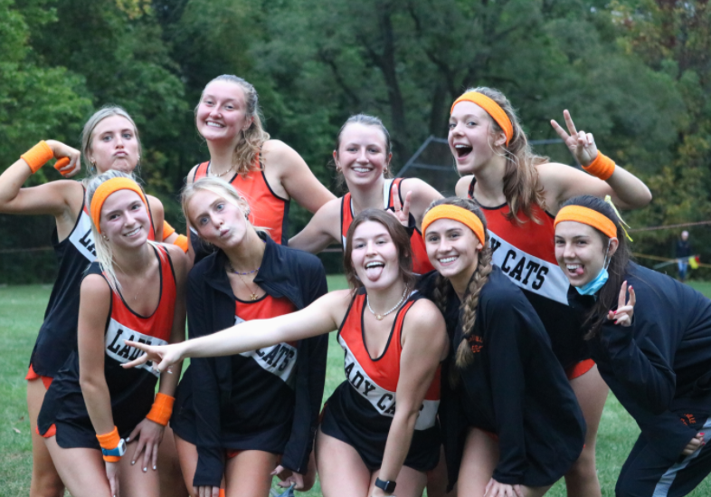 The seniors pose for a photo after the final home meet of their high school careers. 

