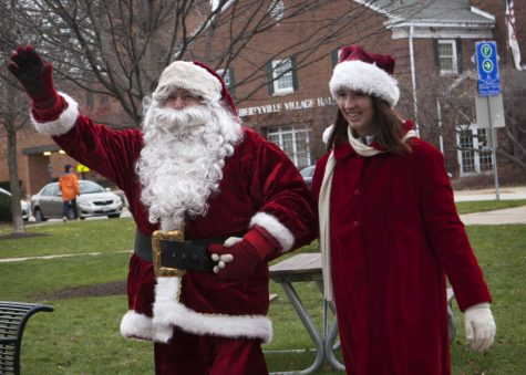 (Photo provided by Mainstreet Libertyville) Santa Claus and Mrs. Claus make their rounds and greet the parents and children in Cook Memorial Park.