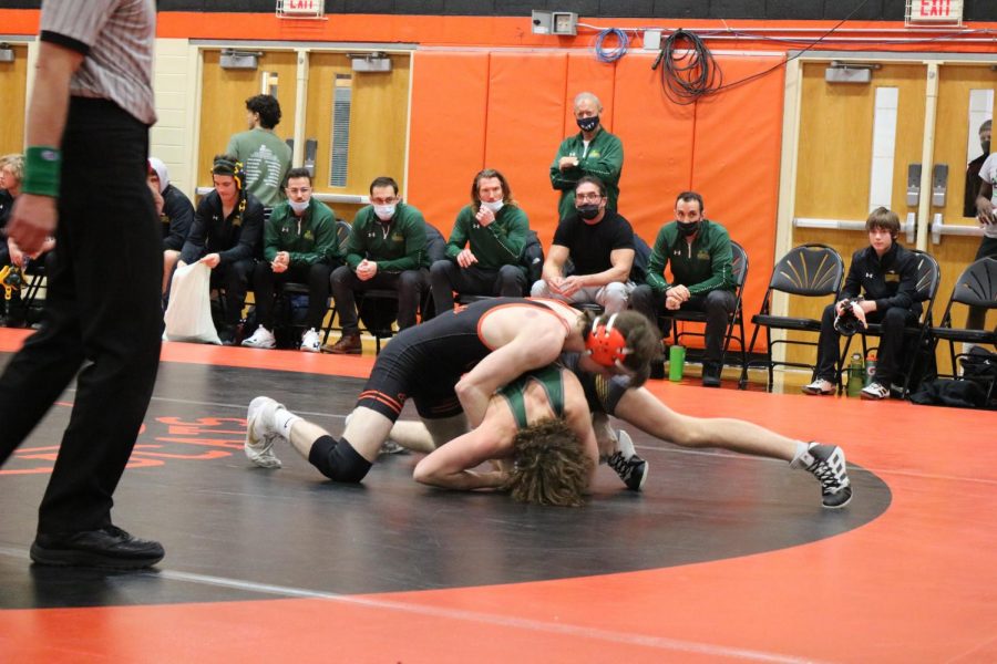 Senior wrestler Trevor Jean takes the advantage over his Stevenson opponent, scoring a takedown and two points for his individual match.