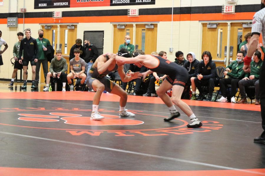 Senior wrestler Scott Wiegold stands off against his Stevenson opponent. Both fight to try and make the first takedown.
