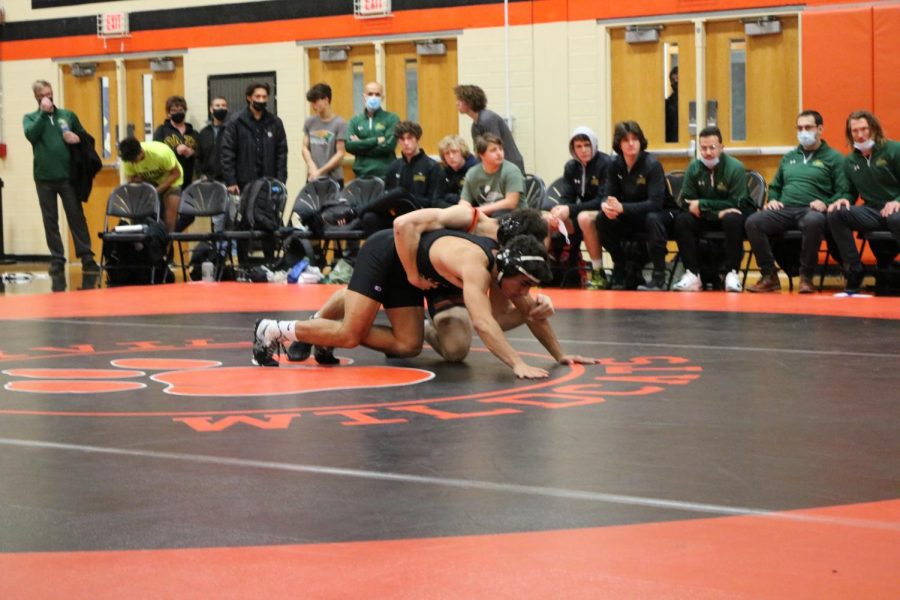 Senior wrestler Michael Rocco gets the advantage before taking down his opponent.