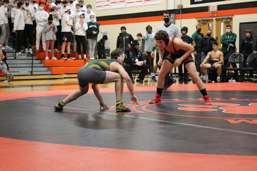Sophomore wrestler Matt Kubas circles his opponent, fighting to get LHS another round victory.