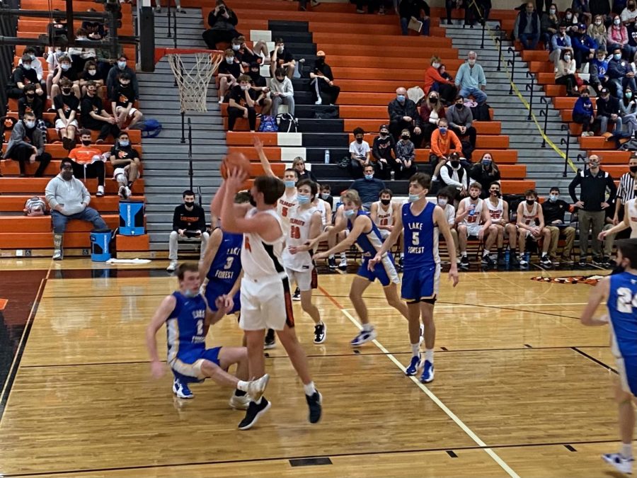 Cole Bonder (35) goes up strong for a layup after battling in the post.