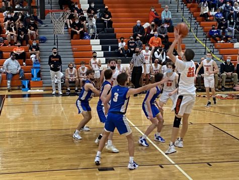 Jack Huber (22) pulls up for a mid range jumper to score two of his nearly 20 points.