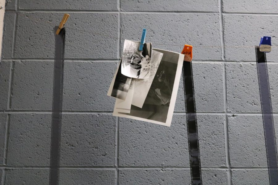 Pictured is the darkroom where Darkroom Photo students process and develop their film. The only light allowed within the room are red lights which protect the film getting ruined when being developed. 