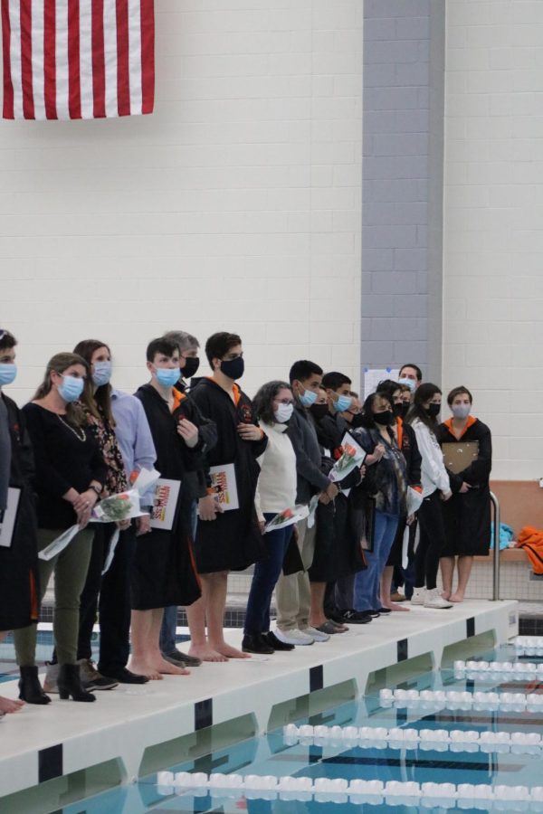 The seniors line up on pool deck for a final group photo.