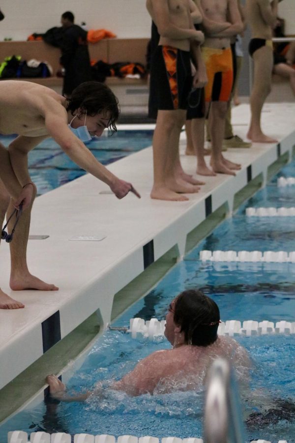 Senior Jack Hamilton cheers on Junior Nolan McDonald during Varsity’s 200-yard IM.
