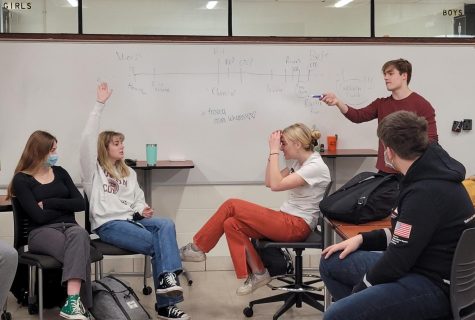 Senior Owen Haywood helps lead a discussion about which cereal is best? Topics at The Gray Area vary from light-hearted topics like cereal preference to serious topics such as state laws and the legalization of marijuana.
