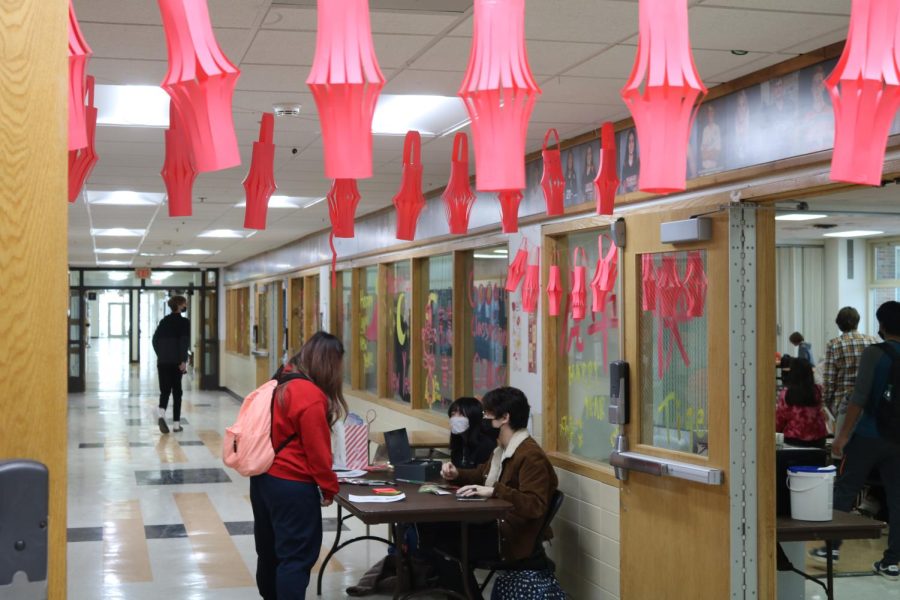 API Unite members Nico Adriano and Danielle Lam sell candy grams to fundraise for the Lunar New Year.