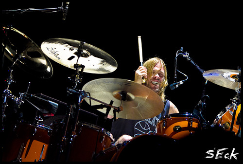 Rock and Roll Hall of Fame inductee Taylor Hawkins, drummer for the Foo Fighters, rocks out on the drum set during a performance.