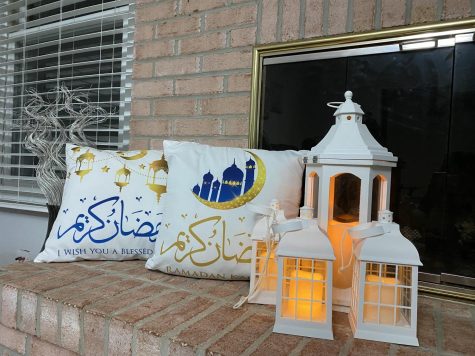 These bright lights, lanterns and crescent moon decorations adorn this house to celebrate Ramadan. The crescent moon and star are Islamic symbols. Lanterns have always been a traditional decoration that many Muslims around the world put up every Ramadan. The pillows in the back say “Ramadan Kareem” in Arabic writing, the dominant language of Islam.