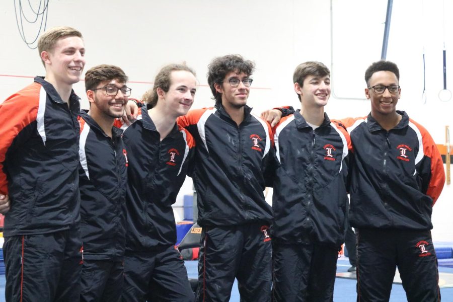 (From left to right). Seniors Grady Georgia, Carlos Cabrera, Chris Giamis, Gabe Sage, Ian Moss, and Anthony McClendon take a group photo in celebration of Senior Night. The meet is the last meet being hosted by Libertyville High school.