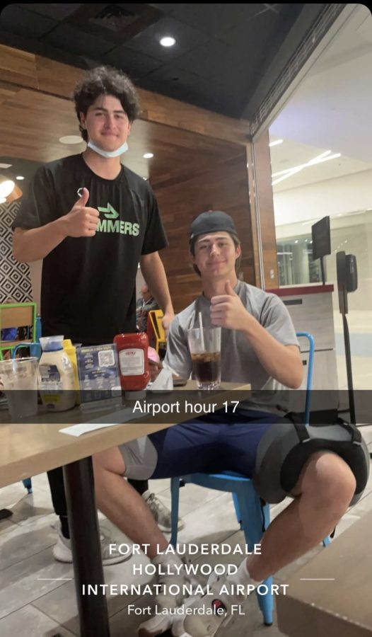 Seniors Connor Walters and Michael Addari smile through the struggle of 40 hours at an airport. 