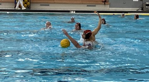 Yaseen Tolba lunges past his opponent to steal the ball with relentless defense.