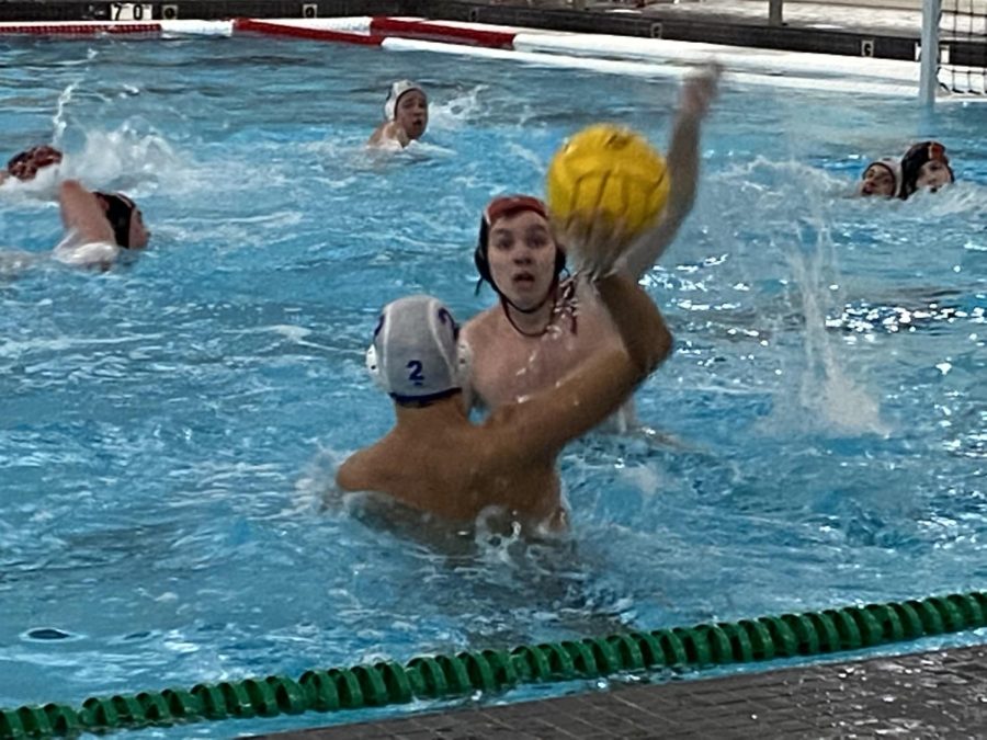 Peter Fink soars out of the water attempting to block one of Lake Forest’s passes.