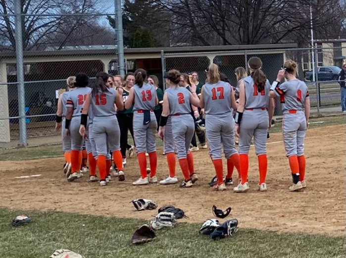 LHS varsity girls softball team exchanges high-fives with Crystal Lake at the end of the game