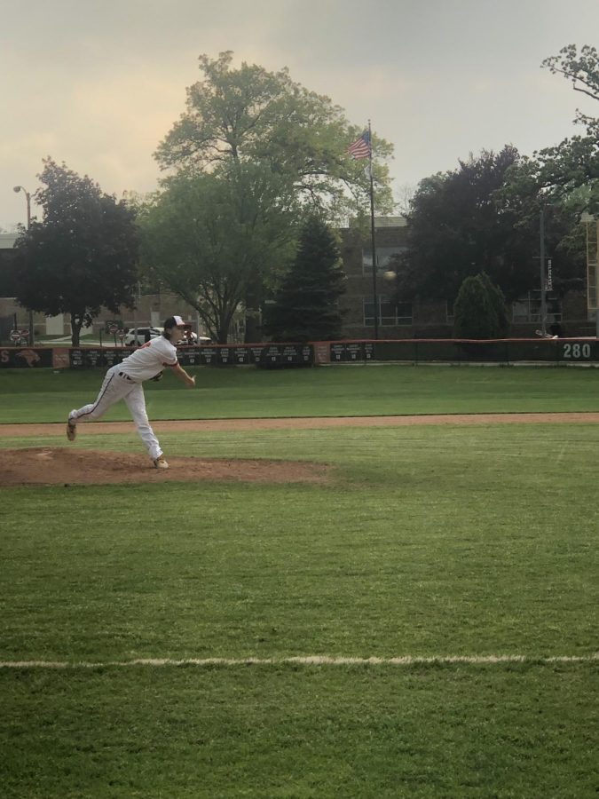 On+the+mound%2C+Joey+Frega%2C+senior%2C+practices+his+pitching+in+preparation+for+the+next+inning+in+the+game+against+Highland+Park+on+Friday%2C+May+20%2C+2022.