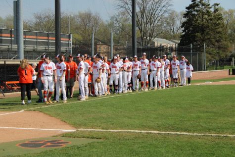 Before the start of the game, the players line up with teachers for teacher appreciation.