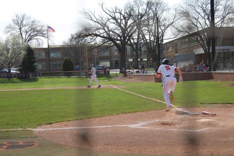 Everett Cortesi takes off for first after making contact at the plate.