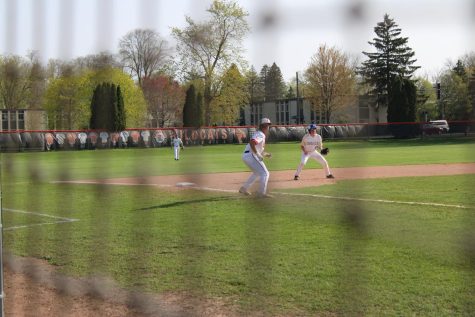 Cole Collins takes a long lead at 3rd in hopes of bringing in a run.