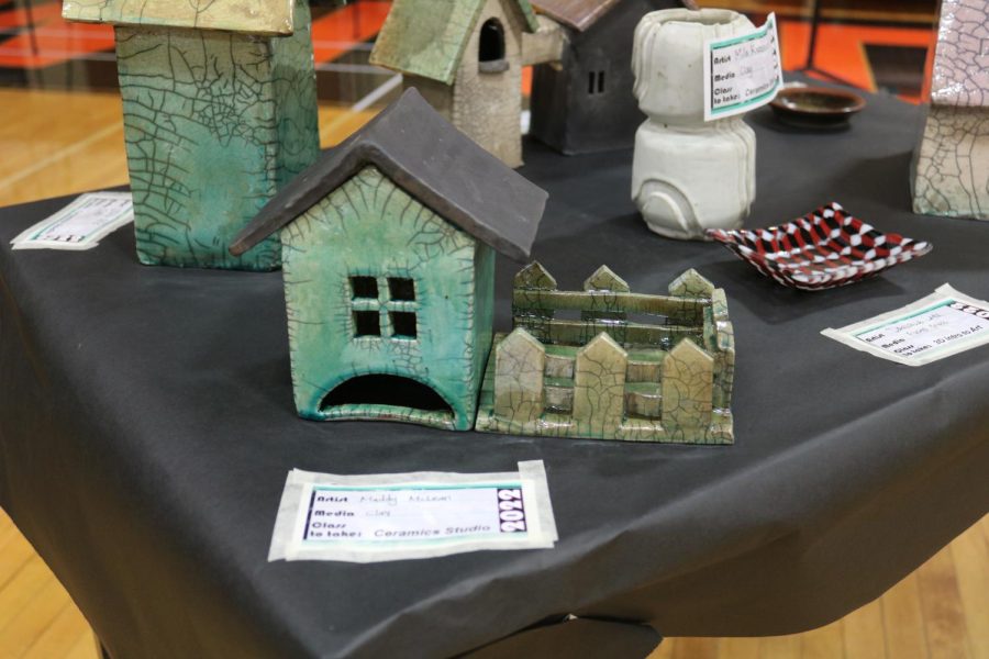 Students from all of the different art classes had pieces in the show. Houses made by Ceramics Studio students were made by a special firing process called Raku Firing.