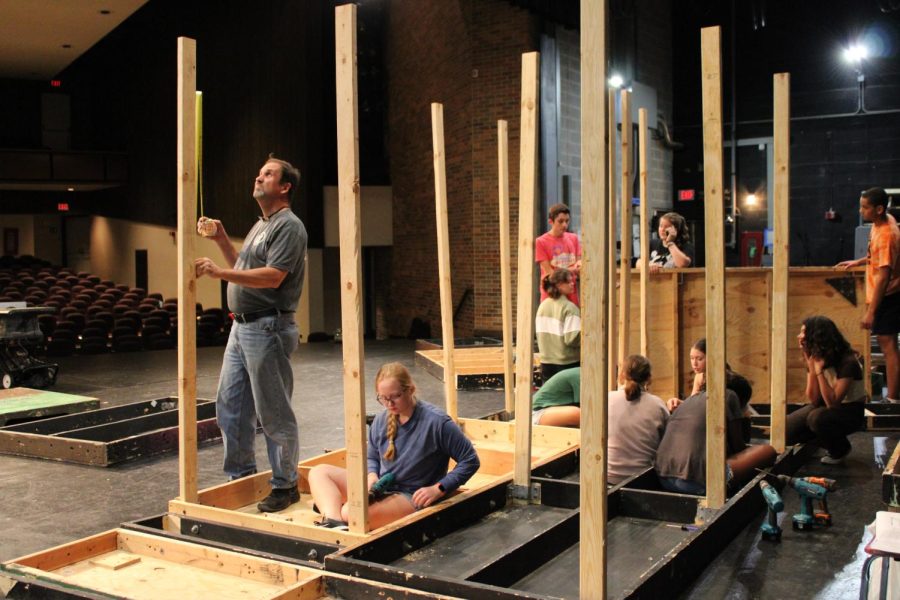 On the second day of crew, Mr. Holly and the crew members begin to construct set pieces for the musical. They are focused on building platforms for the pit. 
