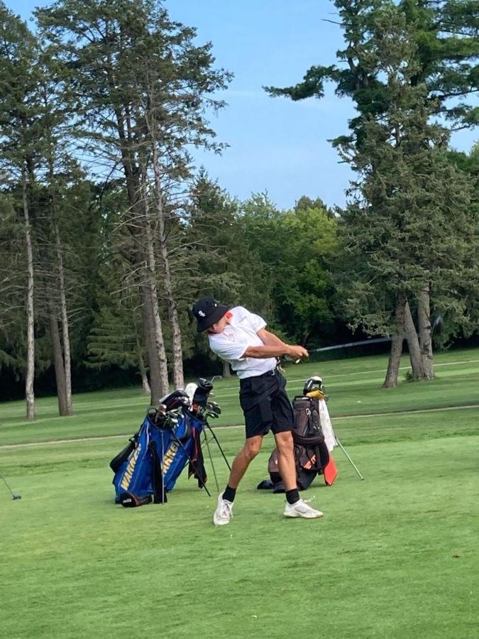 Senior Leo Scopacasa tees off on the second hole at Pine Meadow Golf Course. 