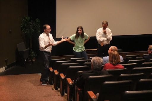 Senior Aayla Budak, Dr. Koulentes, and Mr. Lapish meet with the D128 Board of Education before showing them the courtyard.